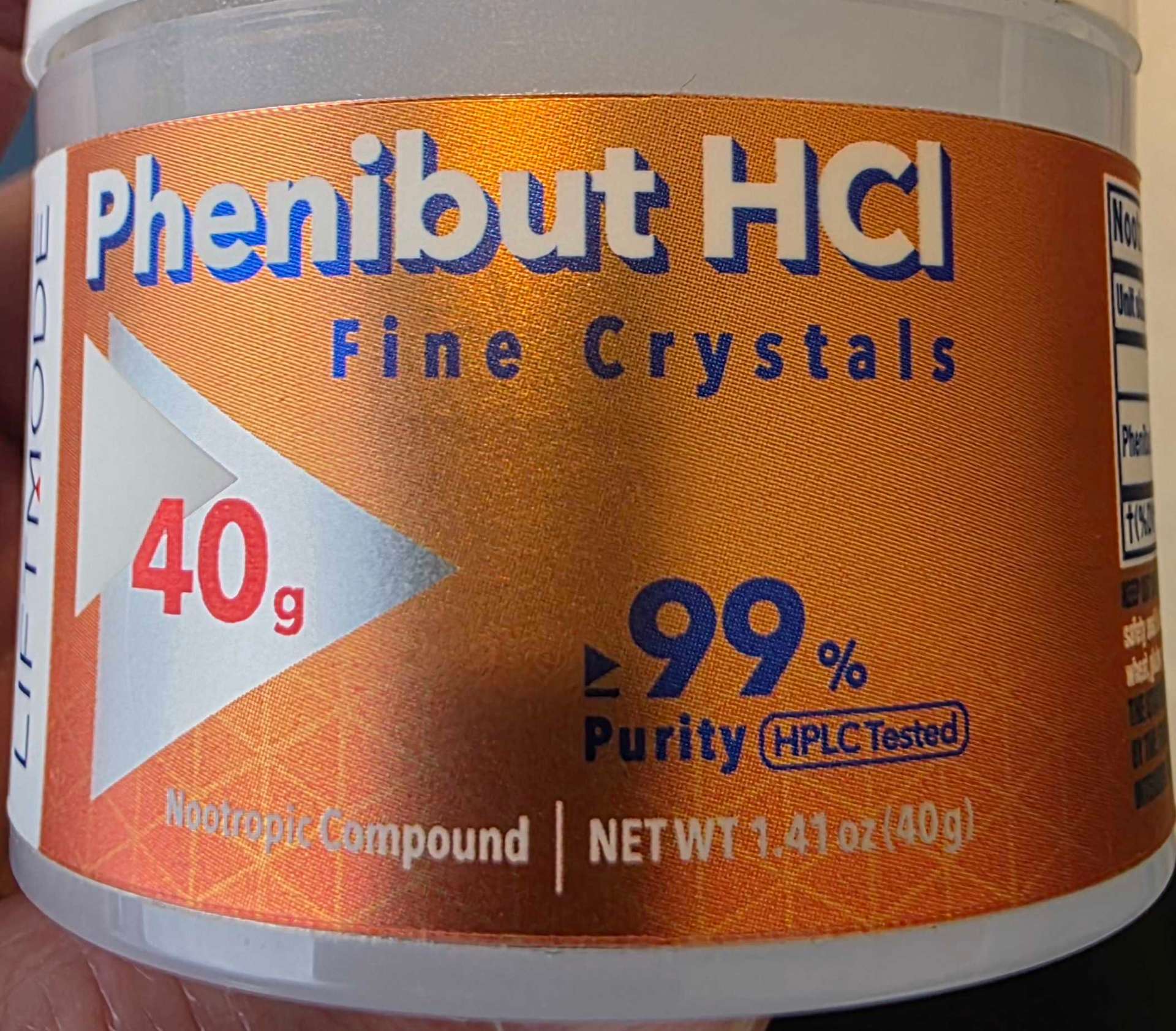 A phenibut HCl powder container marketed as a nootropic compound, 40g at 99% purity